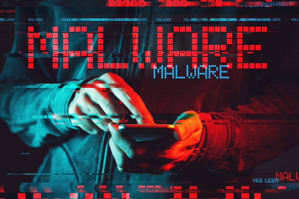 Malware concept with person using smartphone